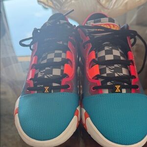 Nike PG 6 x Hot Wheels collaboration sneakers in a blue, orange, and red